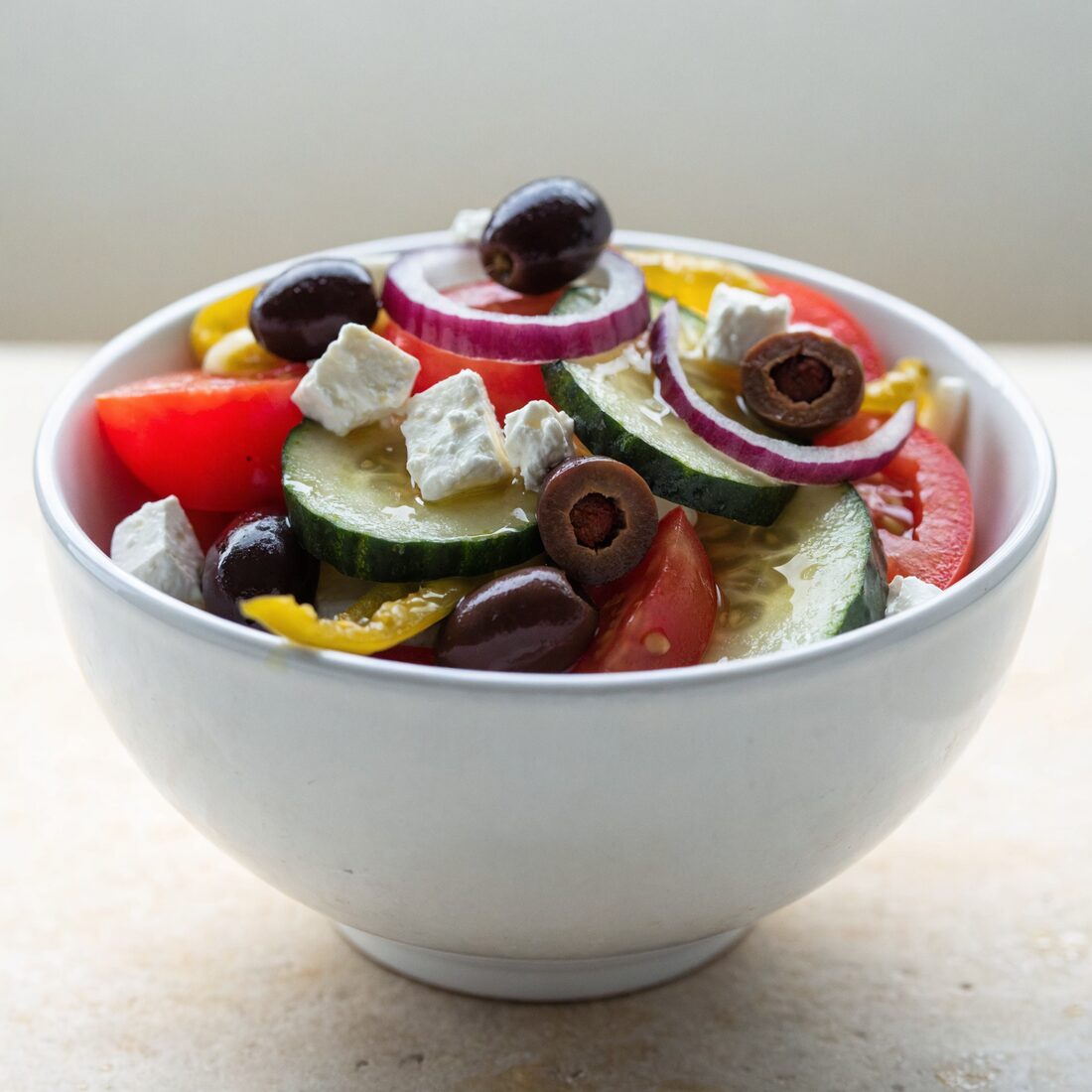 Ripe tomatoes, cucumber, onion, crumbled feta, kalamata olives, pepperoncini peppers, and our house made vinaigrette