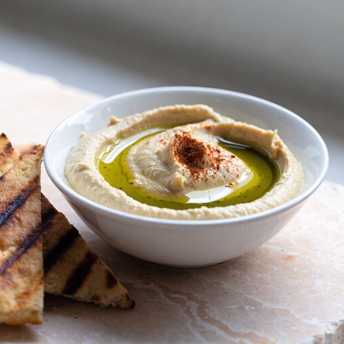 Delicious blend of garbanzo beans, olive oil, and lemon juice served with fresh pita